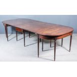 A George III Mahogany Extending Dining Table in Three Sections, comprising - pair of D-shaped side