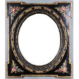 A Black Painted Rectangular Wall Mirror of shaped outline, moulded and carved with roses and