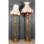 Two Italian Gilt Wood Candlestick Pattern Standard Lamps, with ornate leaf capped turned columns and