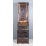 An 18th Century Winchester College Oak Bureau Cabinet or "Toyes" in Three Sections, the whole carved