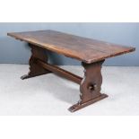 An Early 20th Century Oak Refectory Table of "17th Century" Design, with three-plank cleated top, on