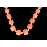 A Coral and Pearl Necklace, Modern, by Pleasance Kirk, comprising barrel coral beads interspersed