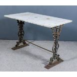 A Cast Iron Rectangular Garden Table, with white veined marble slab to top, on cast iron scroll