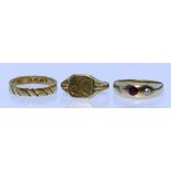 A Gem Set Ring, 18ct gold, set with a centre garnet flanked by two small diamonds, size P, and two