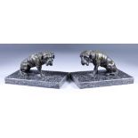 A Pair of French Green Patinated Bronze Figures of Bulldogs, 19th Century, each seated on a