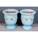 A Pair of Turquoise Glazed Terracotta Urn Pattern Planters, the exterior moulded in relief with