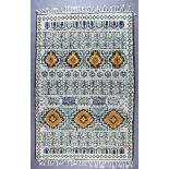 A North African Berber Carpet, Modern, woven in muted colours, the field filled with seven lozenge