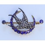 A Sapphire and Diamond Set Bluebird Pattern Brooch, Late Victorian, in gold coloured metal mount,