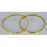 Two 22ct Stiff Bangles, Modern, total gross weight 26.7g