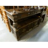 A LARGE HEAVY OAK DUMB WAITER/SIDEBOARD, WITH SECTION TO STORE TABLE LEAVES, HAVING THREE DRAWERS