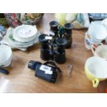 TWO PAIRS OF FIELD BINOCULARS AND A MONOCULAR MICROSCOPE (3)