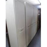 RANGE OF TWO WARDROBES WITH BEIGE FINISH AND FIVE DOORS, 4' AND 2'8" WIDE