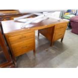 A MAHOGANY DOUBLE PEDESTAL DESK, WITH INLET LEATHER TOP, QUADRANT CORNERS, TWO SHALLOW AND TWO