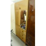 A WOOD EFFECT COMBINATION WARDROBE WITH EXTERIOR MIRROR, 2'8" WIDE