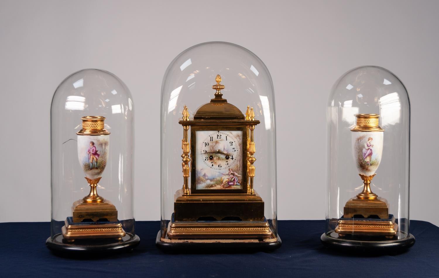 LATE NINETEENTH CENTURY FRENCH GILT AND MATT BRASS THREE PIECE CLOCK GARNITURE, the clock with