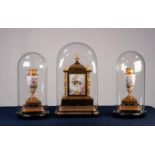LATE NINETEENTH CENTURY FRENCH GILT AND MATT BRASS THREE PIECE CLOCK GARNITURE, the clock with