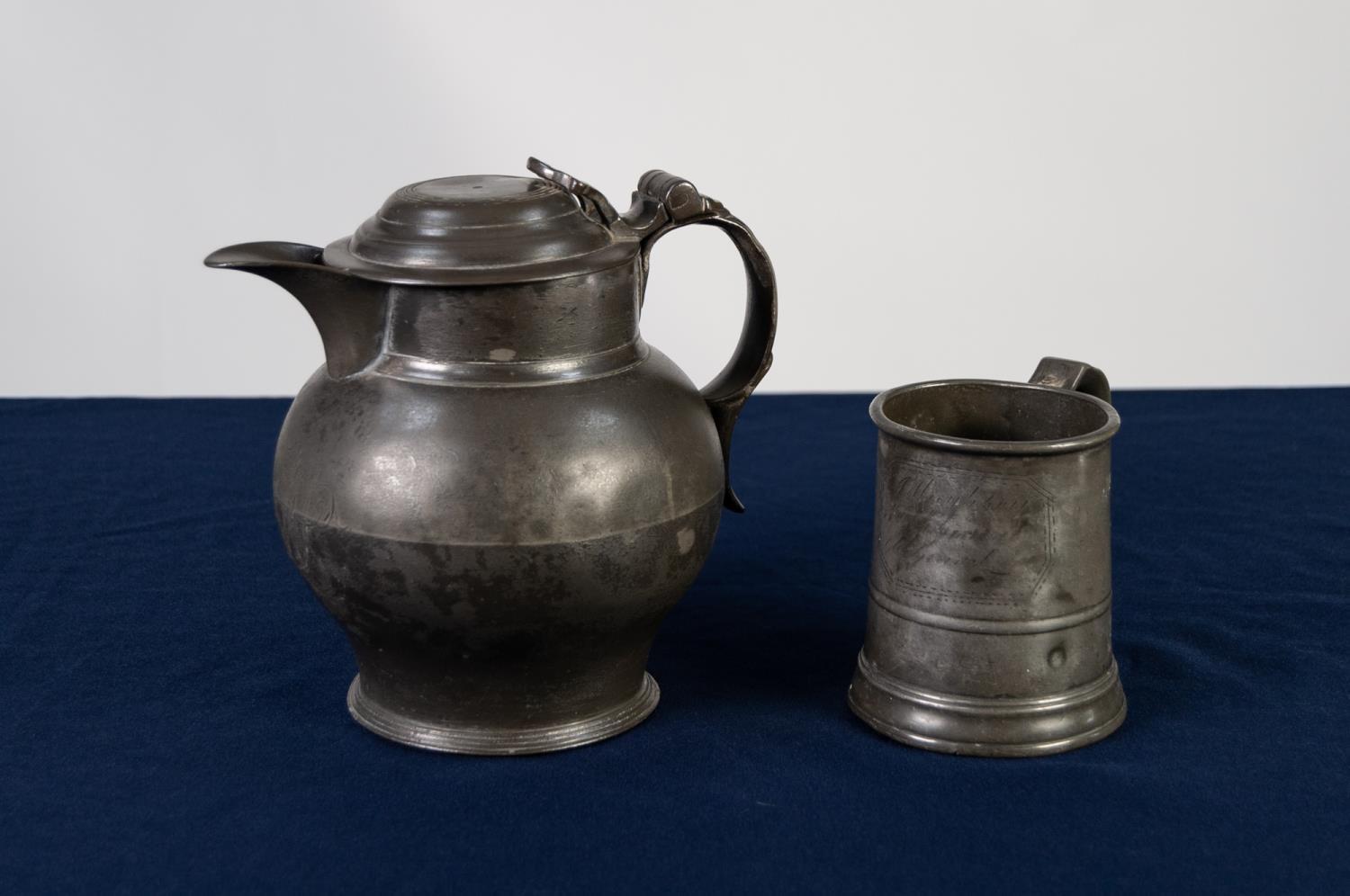 ANTIQUE PEWTER BULBOUS BEER JUG the hinged domed lid with pierced thumb piece on stepped circular