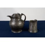 ANTIQUE PEWTER BULBOUS BEER JUG the hinged domed lid with pierced thumb piece on stepped circular