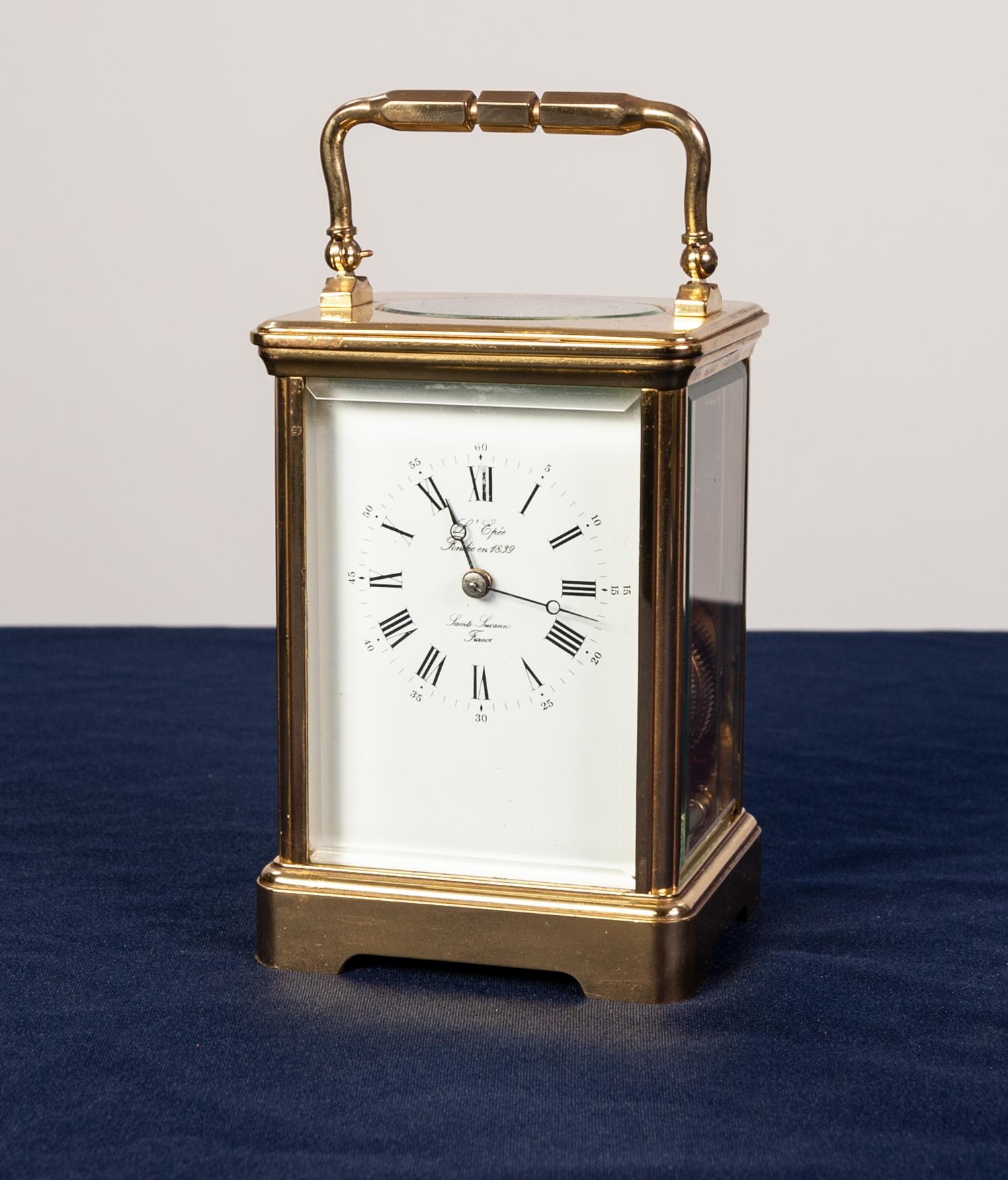 A POST WAR FRENCH CASED CARRIAGE CLOCK the white enamel dial inscribed "L'Epec - Sainte Susanne,