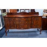 EDWARDIAN BOW FRONTED FIGURED MAHOGANY SIDEBOARD, the shaped oblong top with bow fronted centre