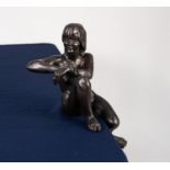 TOM L GREENSHIELDS MODERN COLD CAST BRONZE NUDE FEMALE FIGURE in open seated pose one leg dangling