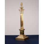 LARGE BRASS CORINTHIAN COLUMN TABLE LAMP of traditional; form with weighted stepped square base