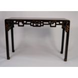 MODERN ORIENTAL BLACK LACQUERED AND POLYCHROME PAINTED SIDE TABLE, the oblong top above a pierced