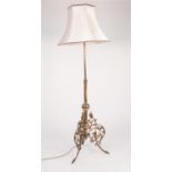 EARLY TWENTIETH CENTURY BRASS STANDARD LAMP, of typical form with ornate pierced tripod base, 70? (