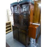 A REPRODUCTION MAHOGANY DISPLAY CABINET, THE UPPER SECTION HAVING TWO GLAZED DOORS, ABOVE ONE LONG
