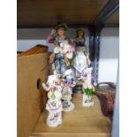 TWO LARGE CERAMIC ORNAMENTS, MAN WITH BAG PIPES, WOMAN WITH MANDOLIN, AND THREE OTHER CERAMICS