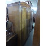 BUTILUX WALNUT WARDROBE WITH ARCHED TOP TWO DOORS, ON STUMP CABRIOLE SUPPORTS (POLISH DAMAGED)