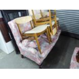 A THREE SEATER AND A TWO SEATER WINGED SETTEES, IN FLORAL FABRIC ON CABRIOLE LEGS