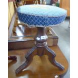 A VICTORIAN ADJUSTABLE PIANO STOOL WITH CIRCULAR SEAT