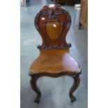 VICTORIAN MAHOGANY HALL CHAIR WITH CARVED SHIELD TO THE PANEL BACK, PANEL SEAT, FRENCH CABRIOLE