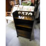 A SMALL OAK OPEN BOOKCASE WITH FALL-FRONT MAGAZINE RACK