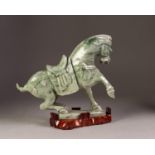 MODERN CHINESE GREEN HARDSTONE MODEL OF A HORSE, on wooden stand