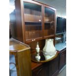 A MAHOGANY TALL SIDE CABINET, THE UPPER PORTION WITH TWO GLAZED DOORS, OVER AN OPEN SECTION AND