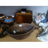 A NORWEGIAN CARVED OAK BOAT SHAPED TWO HANDLED BOWL AND A MAHOGANY CURVED ART DECO BISCUIT BARRELL