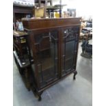 MAHOGANY BOOKCASE ENCLOSED BY TWO ASTRAGAL GLAZED DOORS, ON STUMP CABRIOLE SUPPORTS, 2?9? WIDE, 4?