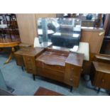 C.W.S. 1960's TEAK BEDROOM SUITE OF THREE PIECES ON 'T.V.' LEGS, VIZ, TWO DOOR WARDROBE, DRESSING