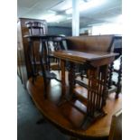 A NEST OF THREE YEW-WOOD COFFEE TABLES AND A MAHOGANY OVAL OCCASIONAL TABLE (2)