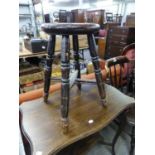 A TALL STOOL WITH CIRCULAR PANEL SEAT ON TURNED LEGS