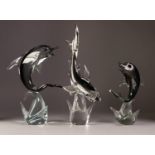 TWO MODERN MURANO, LARGE SMOKEY GLASS MODELS OF DOLPHINS, on clear bases, together with a MATCHING
