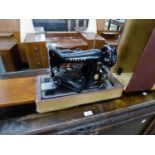 A PORTABLE SINGER SEWING MACHINE, IN CASE