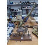 EARLY 20TH CENTURY BRASS EAGLE FIGURINE WITH EXTENDED WINGS ON NATURALISTIC PERCH AND CAMEL FIGURINE