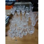 A QUANTITY OF CUT GLASS STEM WINE GLASSES AND TUMBLERS