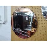AN ART DECO FRAMLESS CIRCULAR WALL MIRROR WITH FOUR OUTER PINK GLASS SECTIONS, 65cm DIAMETER
