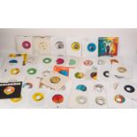 VINYL RECORDS, REGGAE SINGLES 45RPM- A diverse mixture of approximately 40 Reggae singles by various