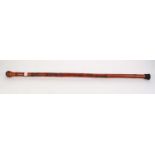 EARLY 20th CENTURY ORIENTAL BAMBOO WALKING STICK shallowly carved with an ascending snake