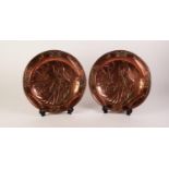 TWO IDENTICAL EARLY 20th CENTURY STAMPED COPPER WALL PLAQUES EMBLEMATIC OF WINTER 12" (30.5)